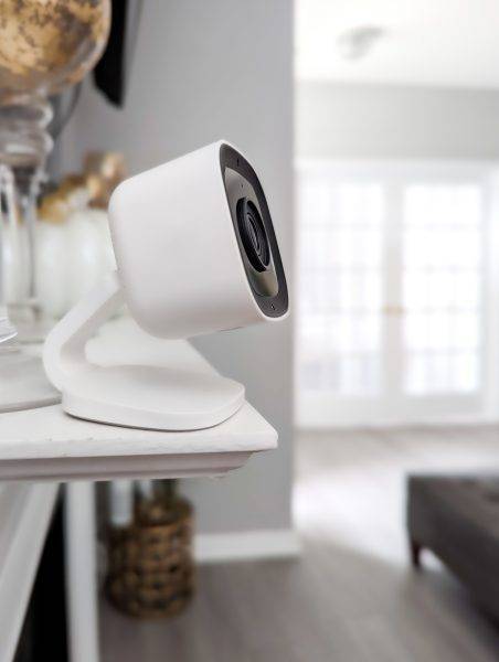 home security camera places on table for home surveillance